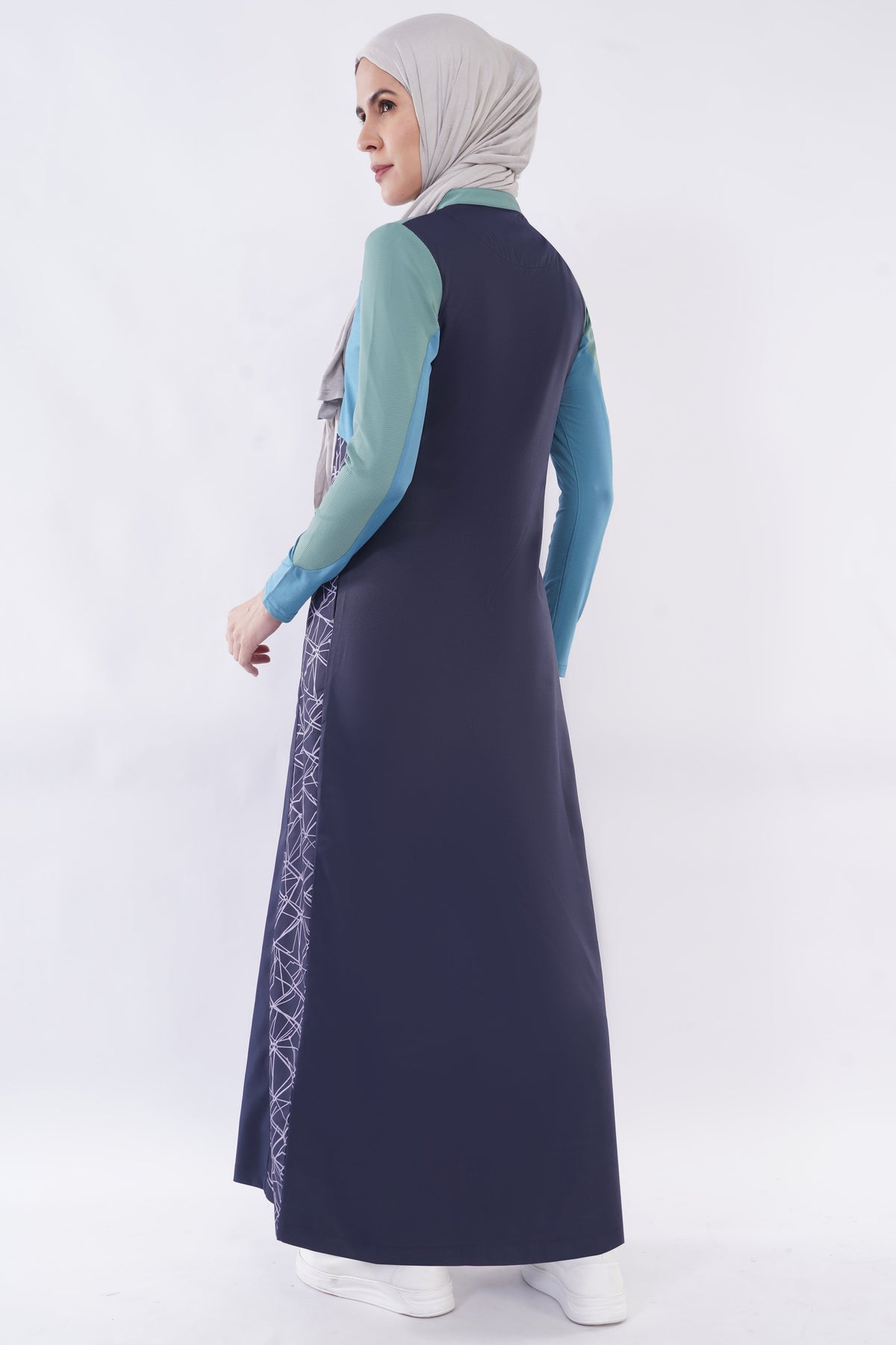 alwaan Oceanic Breeze jilbab in navy blue and sage green with geometric side panels and a relaxed fit